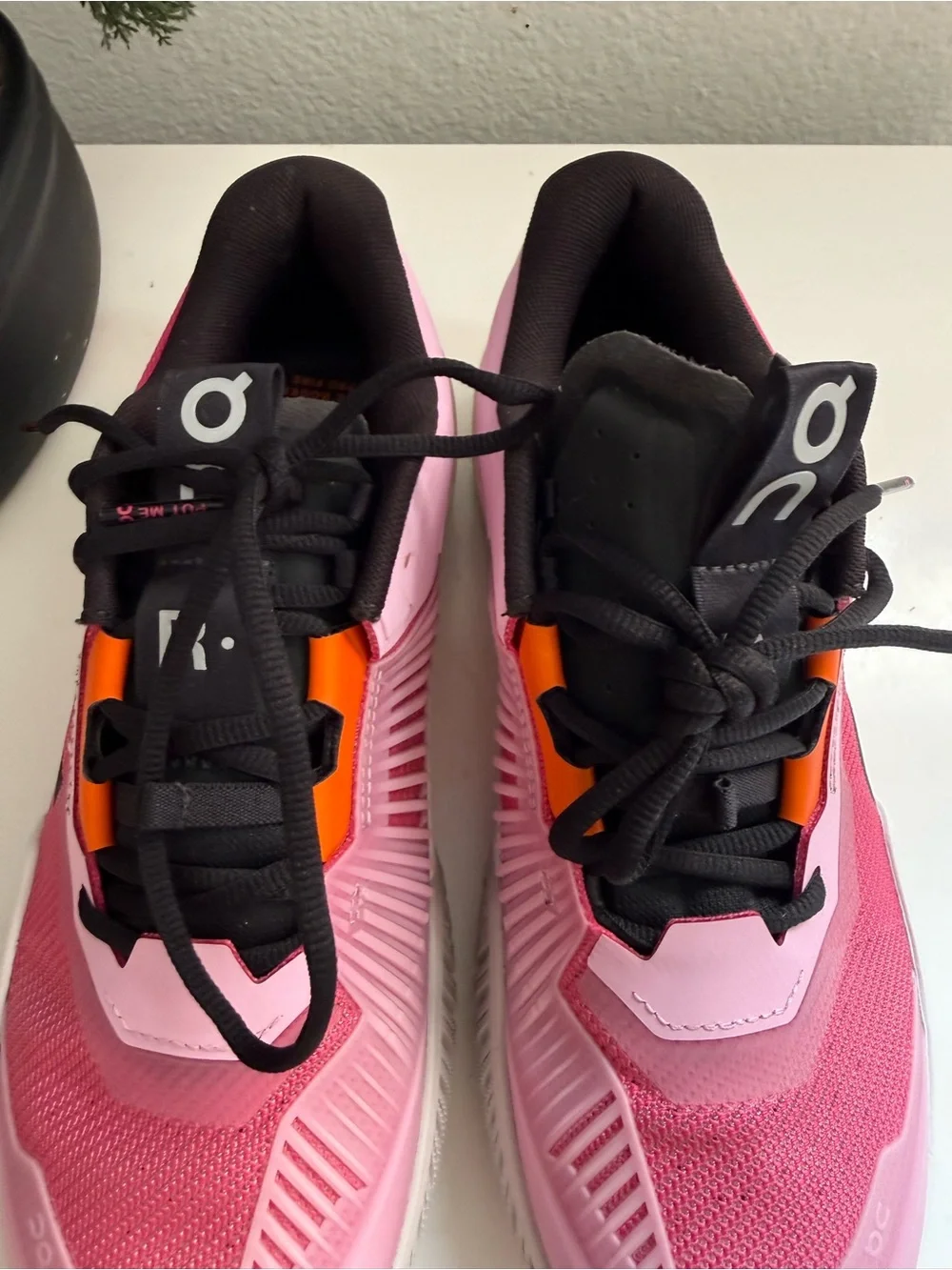 On the Roger pro fire men size 9  or women size 10 pink and Orange Men's Athleti